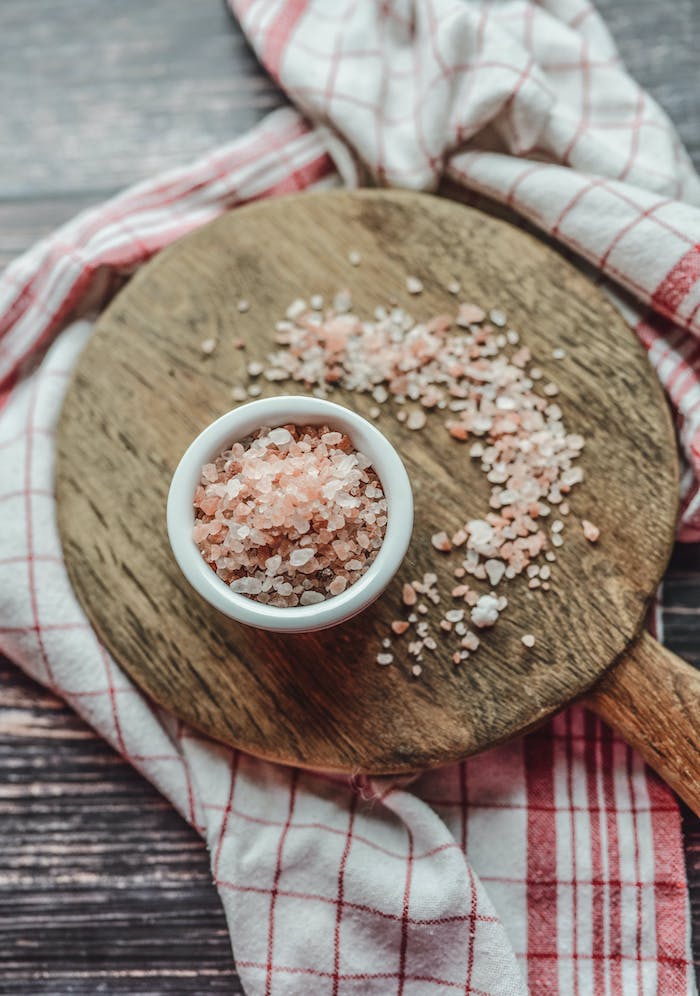 Bowl of Redmond Real Salt on wooden board – ancient sea salt from Utah rich in trace minerals and free from additives