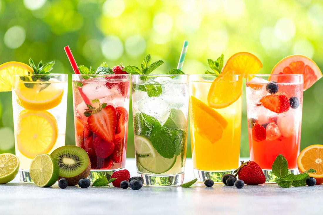 Glasses of fruit-infused water on a sunny table for hydration